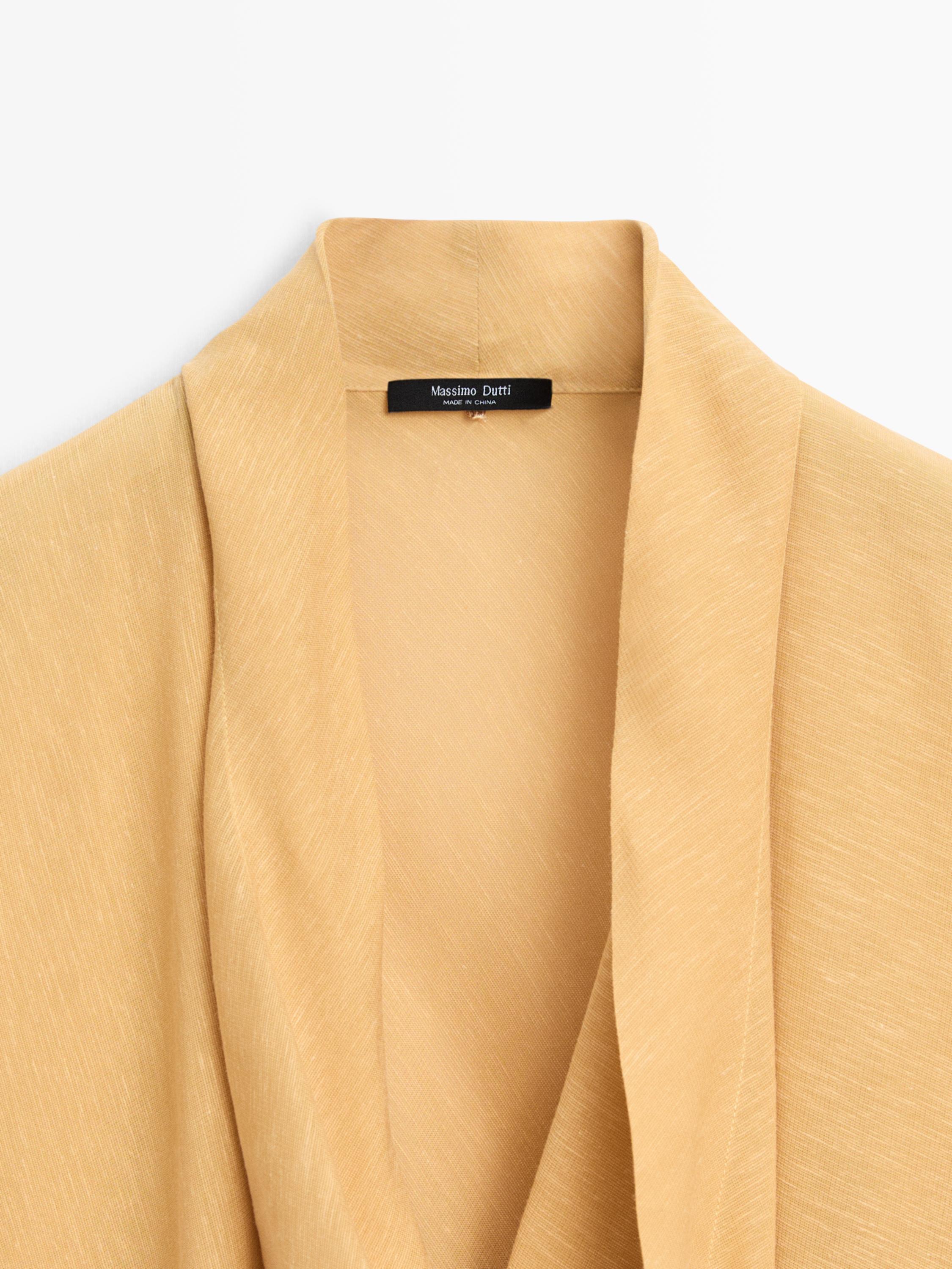 Blouse fluide à décolleté drapé